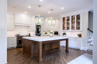 Two-tone white kitchen with walnut Buckskin-stained island and marble counters in Raleigh, NC