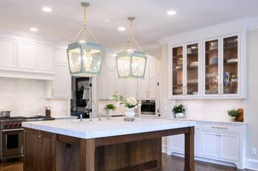 Two-tone white kitchen with walnut Buckskin-stained island and marble counters in Raleigh, NC