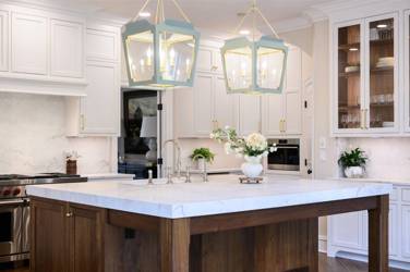 Two-tone white kitchen with walnut Buckskin-stained island and marble counters in Raleigh, NC