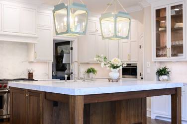 Two-tone white kitchen with walnut Buckskin-stained island and marble counters in Raleigh, NC