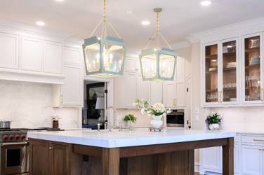 Two-tone white kitchen with walnut Buckskin-stained island and marble counters in Raleigh, NC