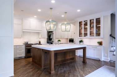 Two-tone white kitchen with walnut Buckskin-stained island and marble counters in Raleigh, NC
