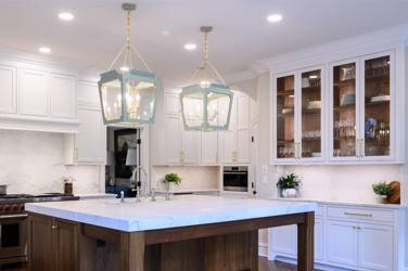Two-tone white kitchen with walnut Buckskin-stained island and marble counters in Raleigh, NC
