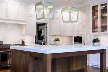 Two-tone white kitchen with walnut Buckskin-stained island and marble counters in Raleigh, NC