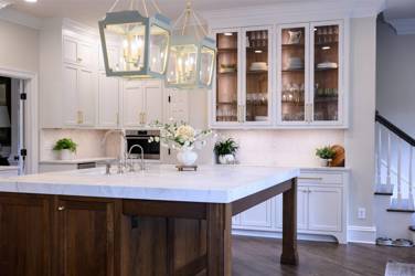 Two-tone white kitchen with walnut Buckskin-stained island and marble counters in Raleigh, NC