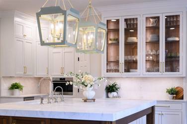 Two-tone white kitchen with walnut Buckskin-stained island and marble counters in Raleigh, NC