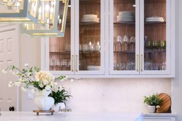 Two-tone white kitchen with walnut Buckskin-stained island and marble counters in Raleigh, NC