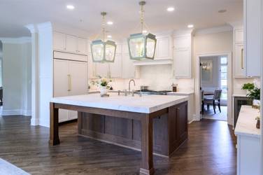 Two-tone white kitchen with walnut Buckskin-stained island and marble counters in Raleigh, NC