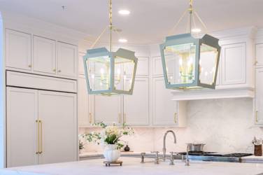 Two-tone white kitchen with walnut Buckskin-stained island and marble counters in Raleigh, NC