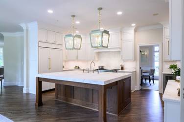 Two-tone white kitchen with walnut Buckskin-stained island and marble counters in Raleigh, NC