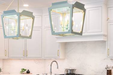 Two-tone white kitchen with walnut Buckskin-stained island and marble counters in Raleigh, NC