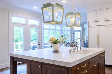 Two-tone white kitchen with walnut Buckskin-stained island and marble counters in Raleigh, NC