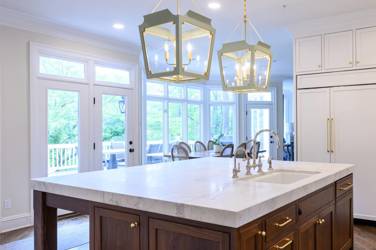 Two-tone white kitchen with walnut Buckskin-stained island and marble counters in Raleigh, NC