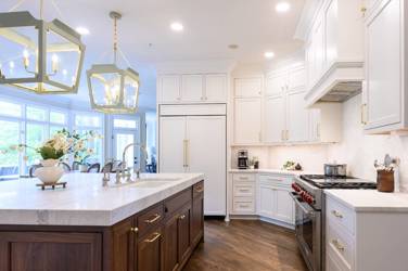 Two-tone white kitchen with walnut Buckskin-stained island and marble counters in Raleigh, NC