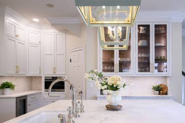 Two-tone white kitchen with walnut Buckskin-stained island and marble counters in Raleigh, NC