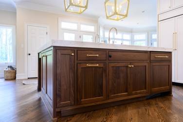 Two-tone white kitchen with walnut Buckskin-stained island and marble counters in Raleigh, NC