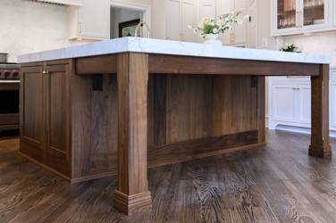 Two-tone white kitchen with walnut Buckskin-stained island and marble counters in Raleigh, NC
