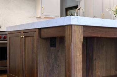 Two-tone white kitchen with walnut Buckskin-stained island and marble counters in Raleigh, NC