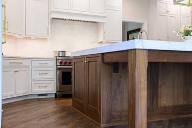 Two-tone white kitchen with walnut Buckskin-stained island and marble counters in Raleigh, NC