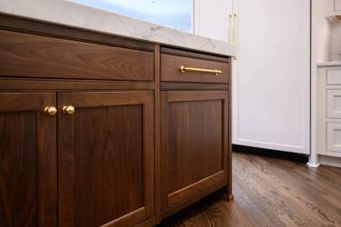 Two-tone white kitchen with walnut Buckskin-stained island and marble counters in Raleigh, NC