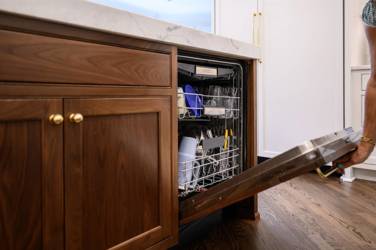 Two-tone white kitchen with walnut Buckskin-stained island and marble counters in Raleigh, NC