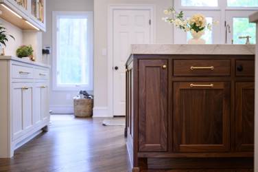 Two-tone white kitchen with walnut Buckskin-stained island and marble counters in Raleigh, NC