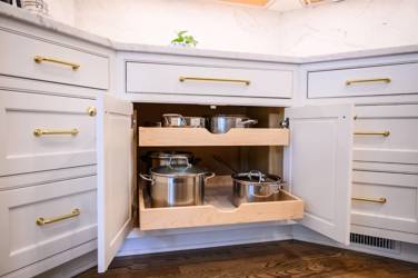 Two-tone white kitchen with walnut Buckskin-stained island and marble counters in Raleigh, NC