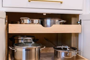 Two-tone white kitchen with walnut Buckskin-stained island and marble counters in Raleigh, NC