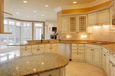 Two-tone white kitchen with walnut Buckskin-stained island and marble counters in Raleigh, NC
