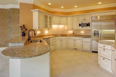 Two-tone white kitchen with walnut Buckskin-stained island and marble counters in Raleigh, NC