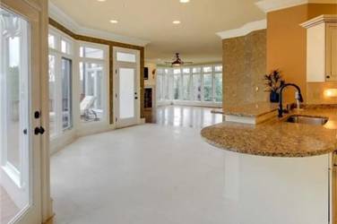 Two-tone white kitchen with walnut Buckskin-stained island and marble counters in Raleigh, NC