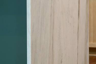 White oak kitchen with sage green island and white quartzite waterfall counters in Raleigh, NC