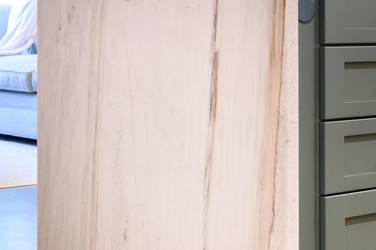 White oak kitchen with sage green island and white quartzite waterfall counters in Raleigh, NC